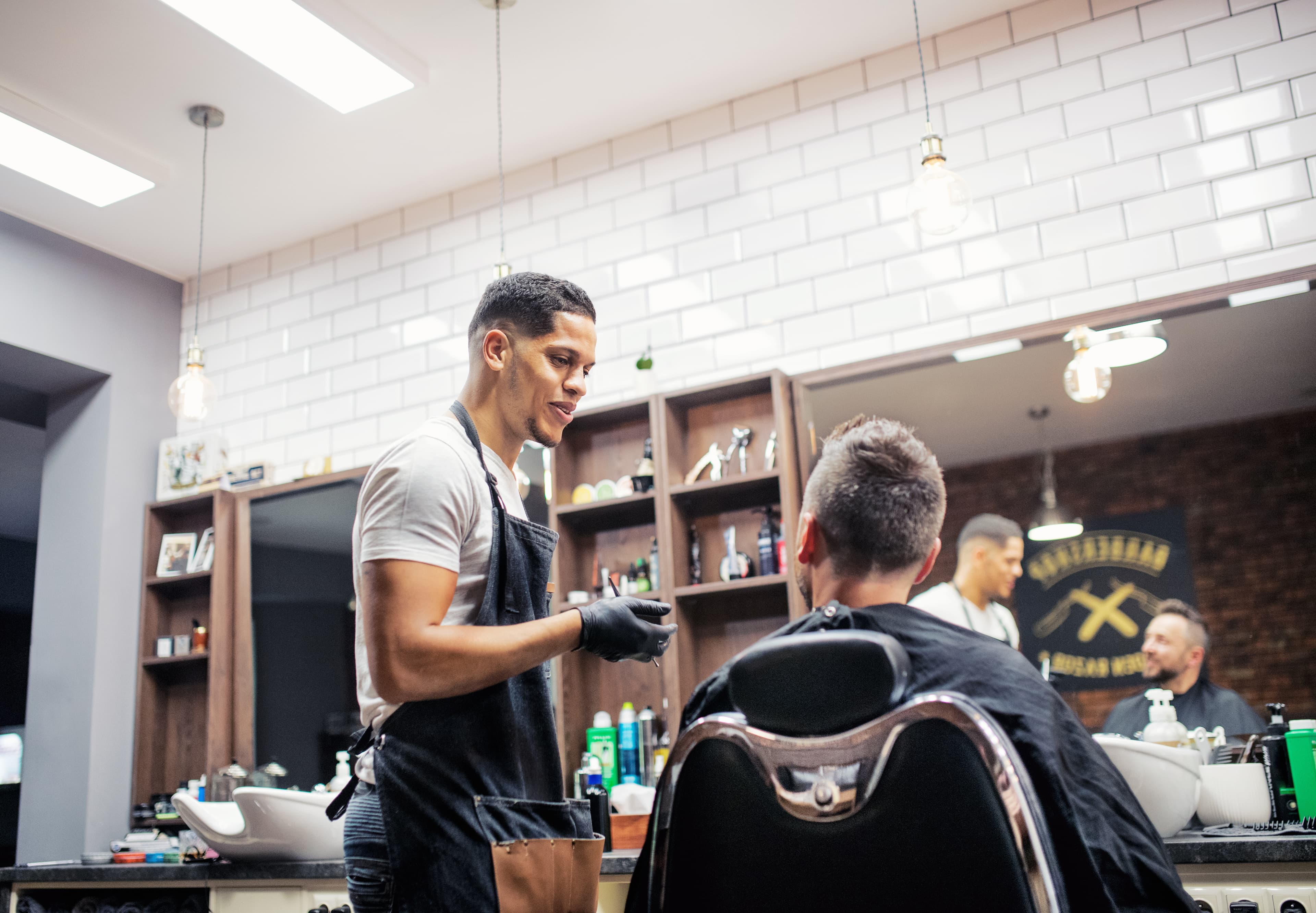 Barber instructor with student